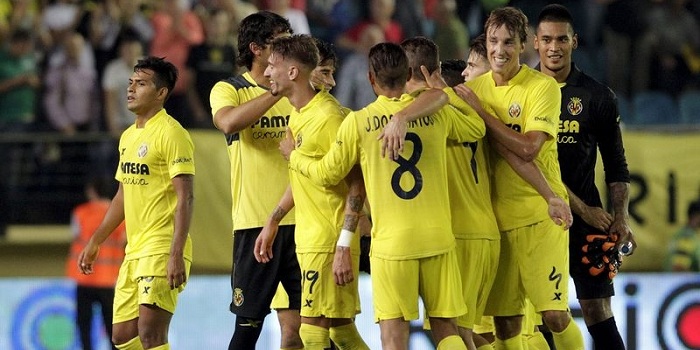 Villarreal's players celebrate their victory over Atletico Madrid after their Spanish first division soccer match at the Madrigal stadium in Villarreal